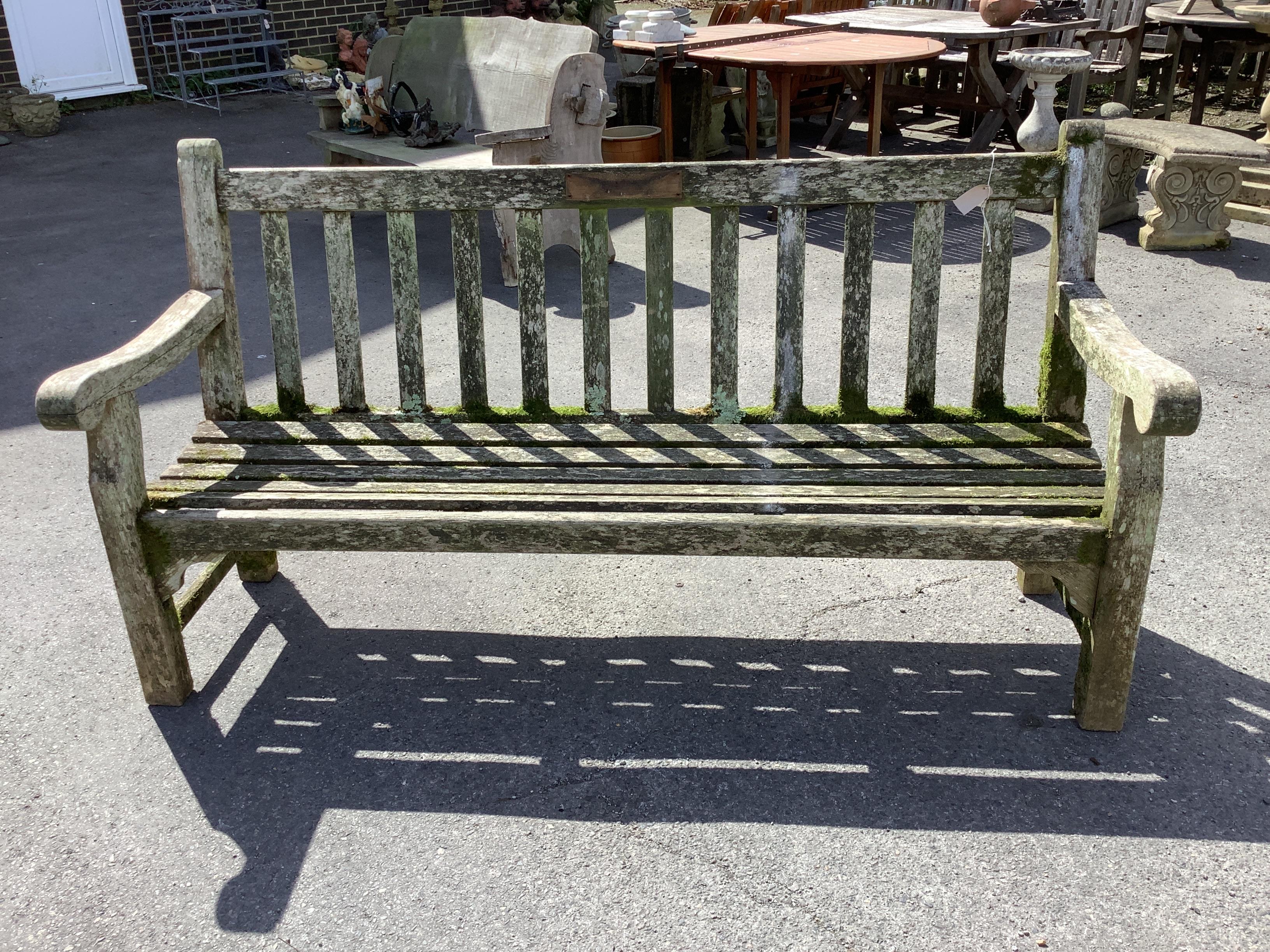 A Lister weathered teak garden bench, width 180cm, depth 63cm, height 95cm